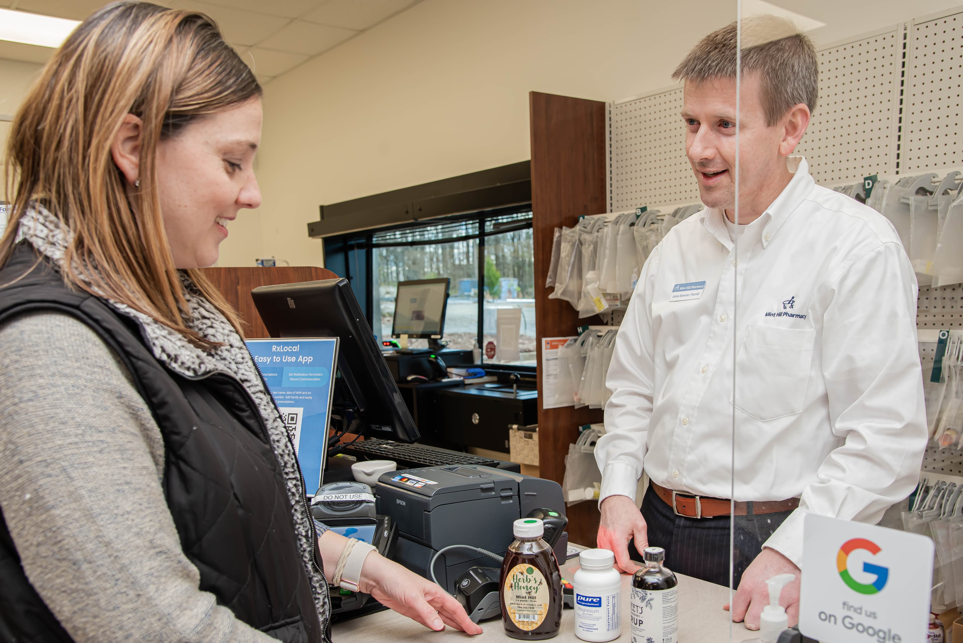 Pharmacist listening to a patient question.